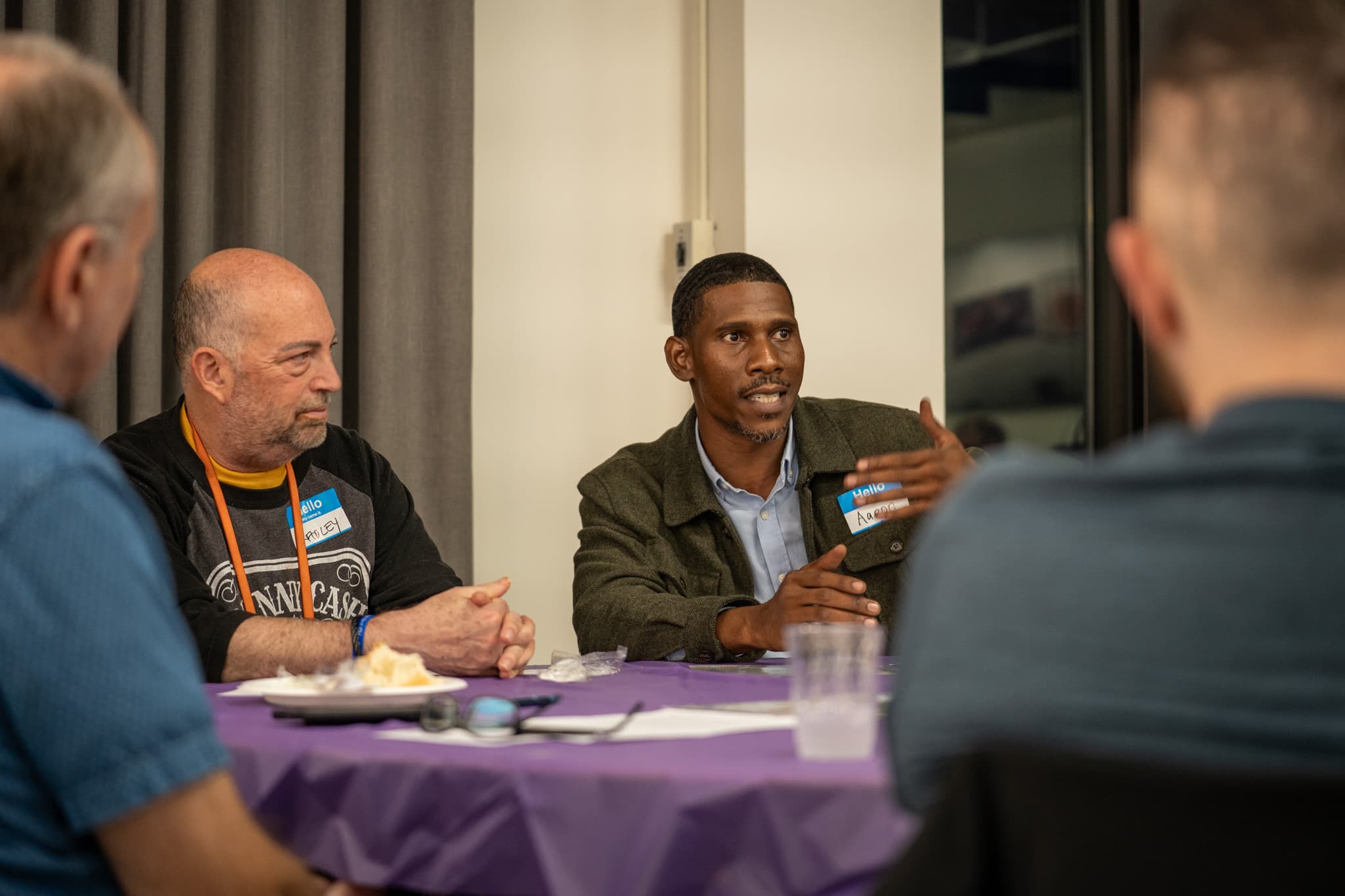 Guests in conversation at a BreadBreakers dinner table
